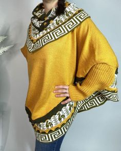 Mustard/Yellow Alpaca Blend Women's Luxury Poncho from The Andes Of Peru. Beautifully crafted poncho sweater, layered with Inca designs. Warm and perfect sweater to wear with jeans or pants, unique and stylish piece goes with just about everything. Comfortable wide cape -  Nice V-neck poncho sweater at the front and rounded at the back ideal for cold winter seasons. Size: One Size / They are all one size/standard Measurements:   L 70 cm / 28 inch - W 98 cm / 38 inch approximate CARE TIPS: - Machine wash on wool program at 30 o C, or just cold water by hand. - Use a detergent for wool. - Do Not Use Spin Cycle or dryers. Air dry. Each piece is uniquely made, it means that you will receive a truly unique product which is why slight difference since it is individually handmade. Colors may appe Trendy One Size Batwing Sleeve Sweater, Yellow Acrylic Sweater For Winter, Yellow Acrylic Winter Sweater, Cozy Yellow Knit Sweater, Soft Knit Yellow Top For Winter, Yellow Knitted Oversized Top, Casual Shawl Knit Sweater, Oversized Knitted Yellow Top, Batwing Sleeve Poncho For Layering