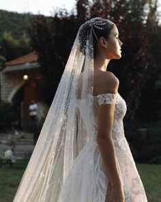 a woman wearing a wedding dress and veil