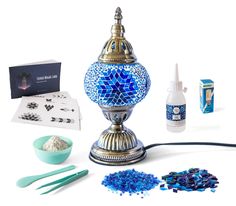 a blue and white vase sitting on top of a table next to other items in front of it