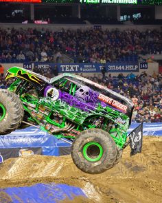 a monster truck is in mid air during a race