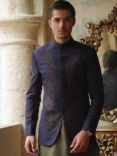 Designer Traditional Wear With Gold Embroidery And Long Sleeves, Designer Sherwani With Gold Embroidery, Embroidered Nehru Jacket For Eid And Semi-formal Occasions, Embroidered Nehru Jacket For Eid Semi-formal, Embroidered Nehru Jacket For Semi-formal Eid Occasions, Embroidered Long Sleeve Bandhgala For Formal Events, Royal Bandhgala For Eid, Royal Sherwani With Zari Work For Formal Occasions, Royal Style Formal Sherwani With Zari Work