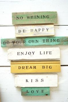 four wooden signs that say, be happy do your own thing enjoy life dream big