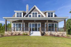 a house that is sitting in the grass