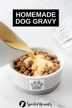 homemade dog gravy is being poured into a bowl filled with puppy food and topped with cheese