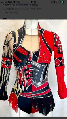 a red and black top with lots of sequins on it