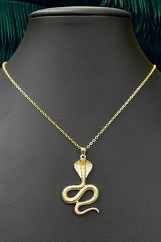 Discover the allure of our exquisite gold cobra necklace, a mesmerizing symbol of power, protection, and transformation. Unleash your inner strength with this timeless accessory, perfect for those seeking empowerment and embracing their unique journey. Explore the rich symbolism of the cobra and its association with wisdom, rebirth, and divine energy. Elevate your style and channel the mystique of the serpent with our remarkable gold cobra necklace. Dainty Gold Rings, Detailed Necklace, Sparkly Jewelry, Protection Necklace, Classic Jewelry, Gold Accessories, Pendant Gold, Timeless Accessories, Simple Jewelry