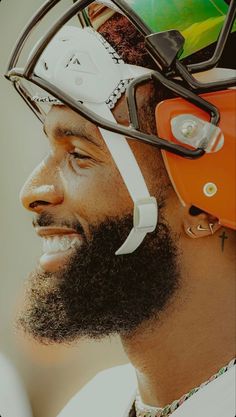 a man with a beard wearing a football helmet