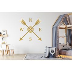 a child's room with a bed and wall decal that says n w e s