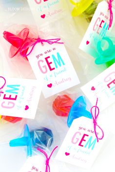 some candy bags with tags on them that say you are a gem