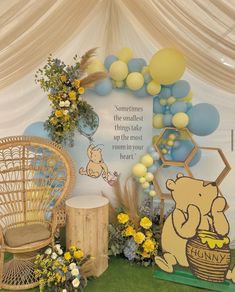 winnie the pooh birthday party with balloons and decorations