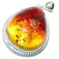 Handmade Unique 925 Sterling Silver pendant with unique one of a kind Amber,  18.90 grams of marvelous handcrafted jewelry design. Only one piece availble ready to ship! It's unique worldwide pendant - simply piece of art in world of fine jewelry. Baltic Amber  .925 Sterling Silver handmade pendant  PENDANT DETAILS: Weight: 18.90g; Material: Sterling Silver; Main stone: Amber; Dimension: L- 2 1/8,  W - 1 1/4, T- 3/8 inch; Inner Bail Diameter: 3/8 inch; Stamp / Mark: 925; Condition: New; Main col Luxury Baltic Amber Jewelry, Unique Amber Sterling Silver Jewelry, Amber Pendant Jewelry Stamped 925, Unique Amber Jewelry Stamped 925, Unique Silver Jewelry, Jewelry Online Store, Silver Pendants, Handmade Pendant, Online Jewelry Store