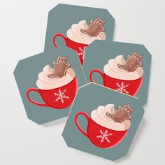 three red cups with whipped cream and chocolate decorations on them, sitting next to each other