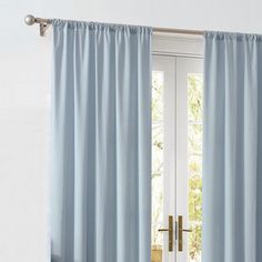 a blue curtain hanging on the side of a door