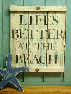 a wooden sign that says life's better at the beach with a starfish