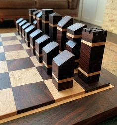 several pieces of wood sitting on top of a chess board