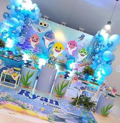 an under the sea themed birthday party with balloons, decorations and decorating items for children's birthdays