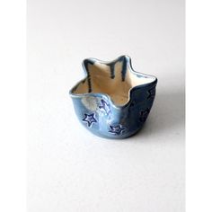 a blue and white ceramic bowl with stars on it