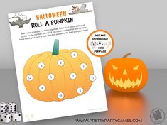 a printable halloween roll a pumpkin game with dices on the table next to it