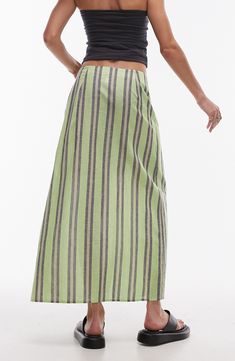 A sarong-style maxi skirt made from lightweight cotton features smart stripes and buckle closure at the waist. 35" length (size 8) Waist buckle closure 100% cotton Machine wash, line dry Imported part lined