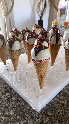 ice cream cones with chocolate and sprinkles on them