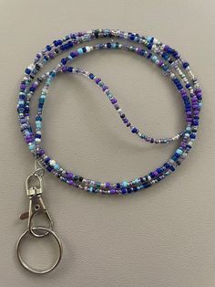 a beaded lanyard with a pair of scissors hanging from it's end