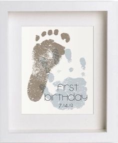 a baby's hand and foot print in a white frame