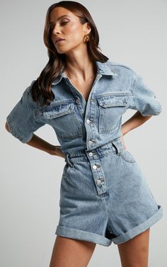 Step into spring with our Leo Denim Playsuit. This collared, short sleeve button front playsuit in a mid blue acid wash is the perfect addition to your casual wardrobe. Made from 100% cotton denim, this fitted playsuit offers both comfort and style all in one. Whether you're heading out for brunch with friends or enjoying a sunny day at the park, this trendy piece will have you looking effortlessly chic. Embrace the versatility of this playsuit by dressing it up with heels or keeping it casual w Denim Jumpsuit Street Style, Denim Jumpsuit Fall, Jumpsuit Outfit Fall, Jumpsuit Outfit Black, Denim Jumpsuit Outfit, Blue Playsuit, Denim Short Jumpsuit, Denim Playsuit, Jumpsuit Outfit