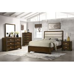 a bedroom scene with focus on the bed and dressers, mirror and nightstand unit