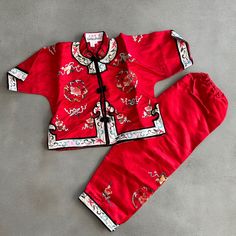 Beautiful Nwot Chinese Outfit In Size 2t. Red Satin With Embroidery Detail. Chinese Button Closure. Pull On Elastic Pants. Red Cotton Set For Spring, Red Cotton Spring Set, Spring Red Cotton Set, Red Playwear Sets For Spring, Red Embroidered Cotton Sets, Traditional Red Sets For Spring, Traditional Red Short Sleeve Set, Fitted Red Playwear Sets, Chinese Button