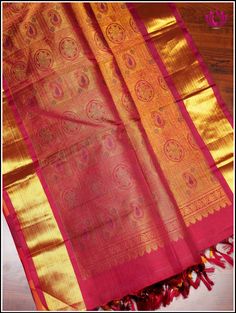 Epitome of luxury and grace, this Kanchipuram silk saree in a stunning color combination is just enough to steal any ocassion. Checkered patterned body in tones of red, yellow and dark green with gold zari woven elpehant and peacock motifs and zari woven border makes it a perfect showstopper for special occasion . Rich pallu adds grandeur. It comes with an unstitched plain blouse. Silk mark certified. Handloom saree. Handmade tassels. Edging done on the other side. Blouse - Unstitched. Please no Elegant Red Handloom Traditional Wear, Classic Saree With Pallu For Festivals, Elegant Red Tussar Silk Traditional Wear, Red Tissue Silk Saree For Traditional Ceremonies, Elegant Red Handloom Saree, Classic Traditional Wear With Pallu For Festive Season, Classic Traditional Wear With Pallu For Festivals, Red Tissue Silk Traditional Wear With Pallu, Classic Saree With Pallu In Traditional Drape