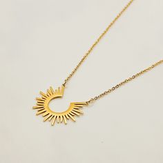 The Sun Necklace is such a fun statement piece. Wear it alone or layer it for different looks. Leave it on for 24/7 worry free wear because it's water safe, sweat proof, and won't turn your skin green. Measures 17 3/8" in length. FEATURES: Nickel & Lead Free Water Safe Sweat Proof Tarnish Resistant 14k Gold plating over 304 Stainless Steel (extreme durability) 1 Year Warranty Includes FREE microfiber pouch. TARNISH PROOF | 24/7 WEAR | 1 YEAR WARRANTY Made with real 18k gold and stainless steel g Necklace Sun, Celestial Sun, Sun Necklace, Gold Girl, Celestial Necklace, Waterproof Jewelry, Girl Jewelry, Summer Necklace, Layering Necklace