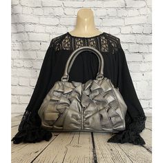 This Stylish Nine & Company Shoulder Bag Is Perfect For Any Occasion. With A Beautiful Gray Exterior Color And Faux Leather Material, This Purse Is Both Durable And Fashionable. The Detachable Shoulder Strap Allows For Versatile Wear, While The Ruffle Accents Give It A Playful And Elegant Touch. Inside There Is One Slip Pocket, A Zipper Pocket, And 3 Card Slip Pocketsperfect To Keep Ask Your Essentials Organized. This Purse Is New Without Tags And Comes From A Smoke-Free Home, Making It Great Ad Chic Ruffled Shoulder Bag For Spring, Gray Exterior, Home Making, Cell Phone Holster, Phone Holster, Walker Boots, Fit N Flare Dress, Rain And Snow Boots, Leather Material