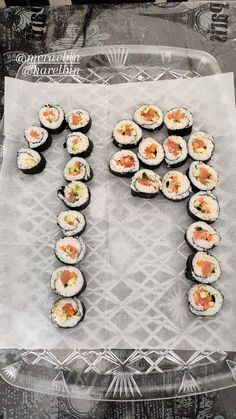 the letter f is made out of sushi rolls