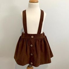 Item: Nwt Cute Girls Corduroy Skirt & Suspender Boutique Classic Americana Bohemian Brown 9-12m Details: Comfy Fit, Decretive Buttons, Adjustable Straps That Tie At The Back, Elastic Waistband Condition: Nwt - Brand (New) Never Used In Good Condition From Clean And Smoke Free Home. Fabric: 100% Cotton /Blend Color: Brown Size: 9m-12m Measurements: Length 9.45", Waist: 17.32", Straps: 30" Cute Cotton Skirt For Fall, Girls Circle Skirt, Orange Floral Skirt, Fancy Skirts, Pink Tulle Skirt, Preppy Plaid, White Maxi Skirts, Twirl Skirt, Pretty Skirts