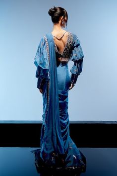 Blue pre-draped ruffled saree with 3D sequin embroidery. Paired with an embroidered padded blouse with sequin and thread embroidery and tasseled hem. - Aza Fashions Blue Pre-draped Saree With Draped Sleeves For Reception, Luxury Blue Pre-draped Saree With Draped Sleeves, Fitted Draped Blue Blouse Piece, Fitted Embellished Blue Pre-draped Saree, Blue Pre-draped Saree With Draped Sleeves, Embellished Blue Pre-draped Saree, Festive Turquoise Pre-draped Saree, Turquoise Bollywood Pre-draped Saree, Ruffled Saree