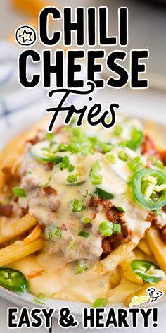 a plate filled with cheesy fries on top of a table