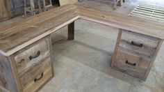 a desk made out of wood with drawers