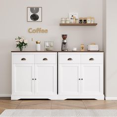 there is a coffee bar in the corner of this room with white cabinets and drawers