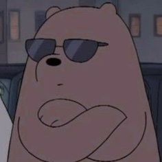 a cartoon bear wearing sunglasses and sitting in the back seat of a car with his arms wrapped around him