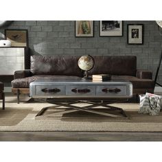 a living room scene with focus on the couch and coffee table, along with other furniture