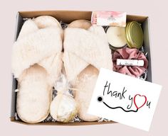 a box filled with slippers, candles and other items to make a gift for someone special