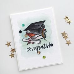 a graduation card with the words congrats written in black and gold on it