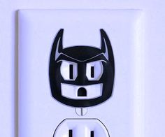 an electrical outlet with a cartoon character on it