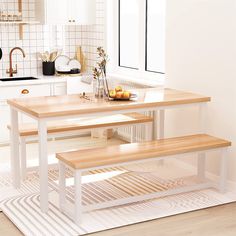 a kitchen table with two benches in front of it