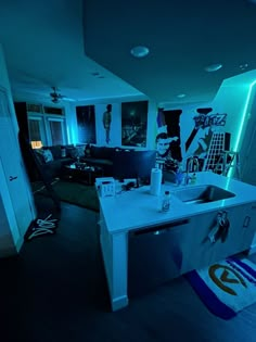 the kitchen is lit up with blue lights