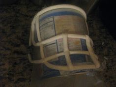 a baseball helmet sitting on top of a counter