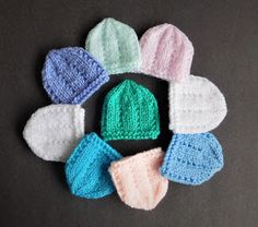 several knitted hats are arranged in a circle