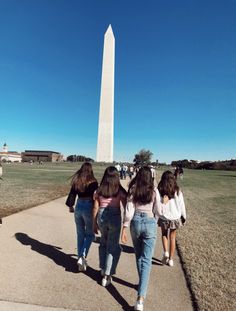 three girls walking towards the washington monument