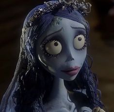 the corpse girl is dressed in blue and has big eyes