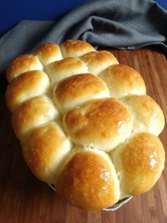 a freshly baked bread sitting on top of a wooden cutting board